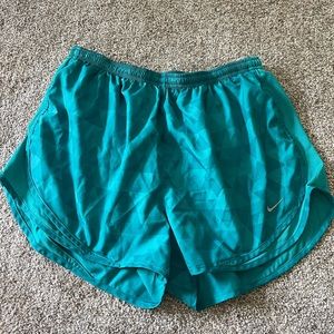 Teal Nike running shorts